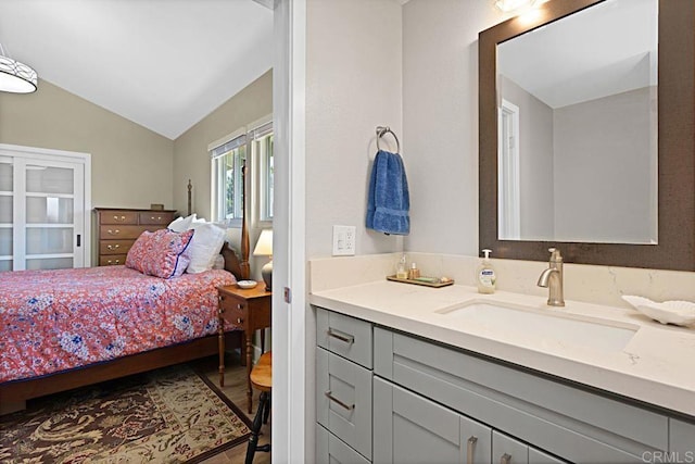 3685 Vista Campana N Unit 72, Oceanside, CA 92057 - bedroom with a sink, lofted ceiling, and wood finished floors