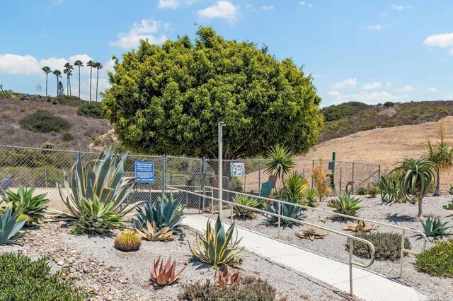3685 Vista Campana N Unit 72, Oceanside, CA 92057 - view of yard with fence and a gate