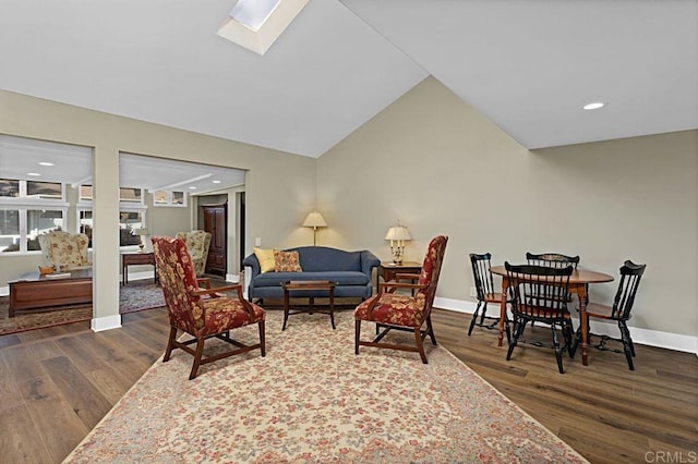 3685 Vista Campana N Unit 72, Oceanside, CA 92057 - living room with wood finished floors, baseboards, a skylight, recessed lighting, and vaulted ceiling