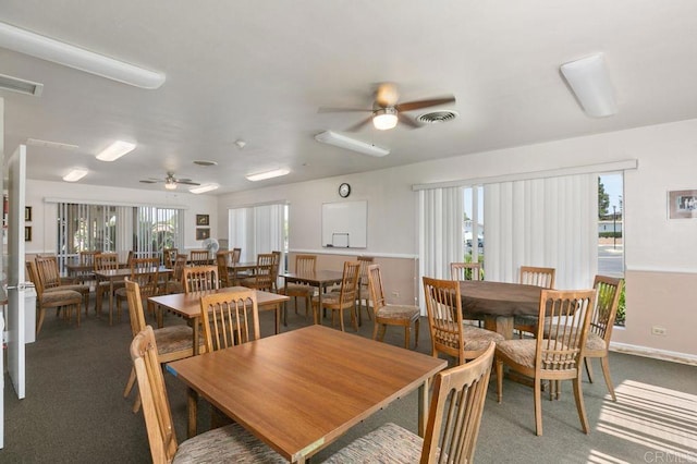 3685 Vista Campana N Unit 72, Oceanside, CA 92057 - dining area featuring a ceiling fan and carpet flooring
