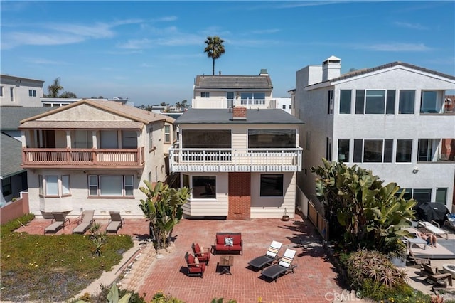 16865 S Pacific Ave, Sunset Beach, CA 90742 - back of house featuring a patio and stucco siding