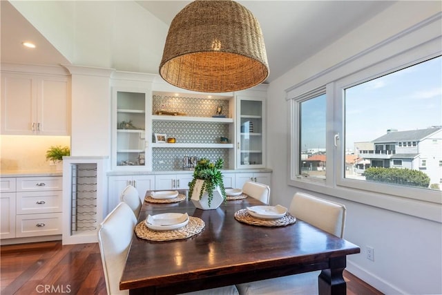 16865 S Pacific Ave, Sunset Beach, CA 90742 - dining area featuring dark wood finished floors and high vaulted ceiling