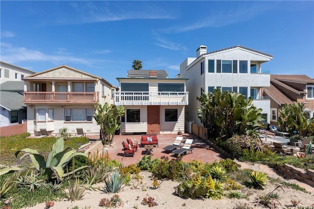 16865 S Pacific Ave, Sunset Beach, CA 90742 - rear view of property with a patio area and a balcony