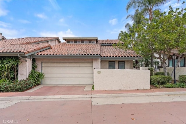 627 Avery Pl, Long Beach, CA 90807 - view of front of home featuring a garage, a tile roof, and stucco siding