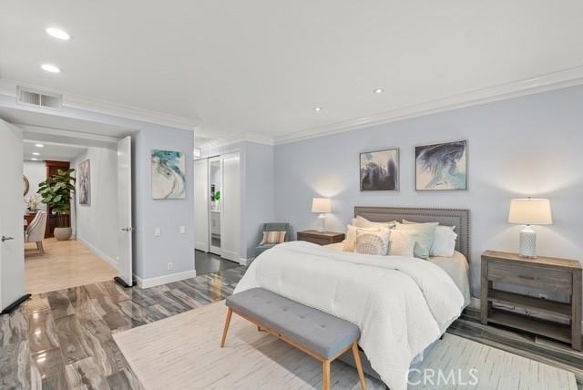627 Avery Pl, Long Beach, CA 90807 - bedroom with crown molding, recessed lighting, baseboards, and wood finished floors