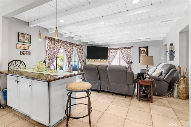 7738 Adwen St, Downey, CA 90241 - living area with light tile patterned floors, wooden ceiling, and beamed ceiling