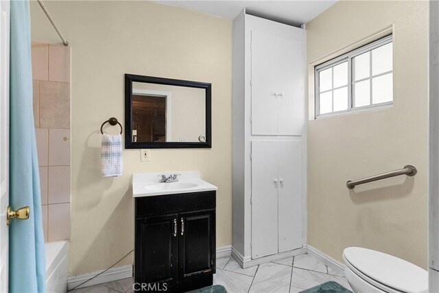 7738 Adwen St, Downey, CA 90241 - full bath featuring shower / tub combo, vanity, baseboards, toilet, and marble finish floor