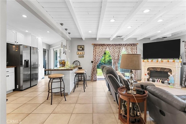 7738 Adwen St, Downey, CA 90241 - living room featuring light tile patterned floors, beamed ceiling, recessed lighting, and visible vents