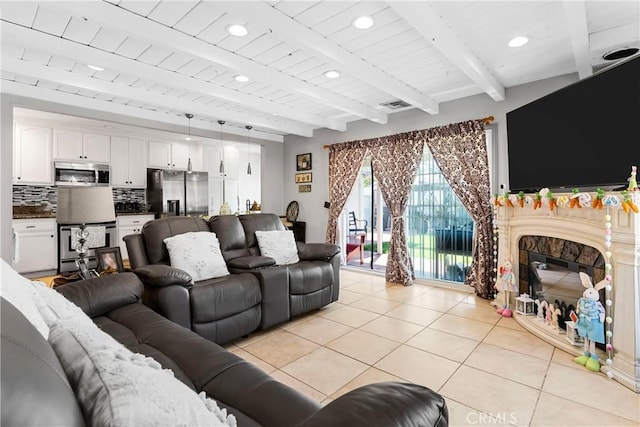 7738 Adwen St, Downey, CA 90241 - living room with recessed lighting, beamed ceiling, visible vents, and light tile patterned floors