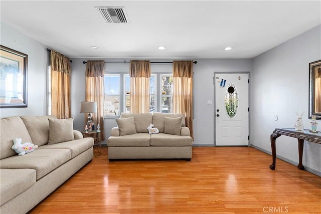 7738 Adwen St, Downey, CA 90241 - living room featuring recessed lighting, light wood-style flooring, and visible vents