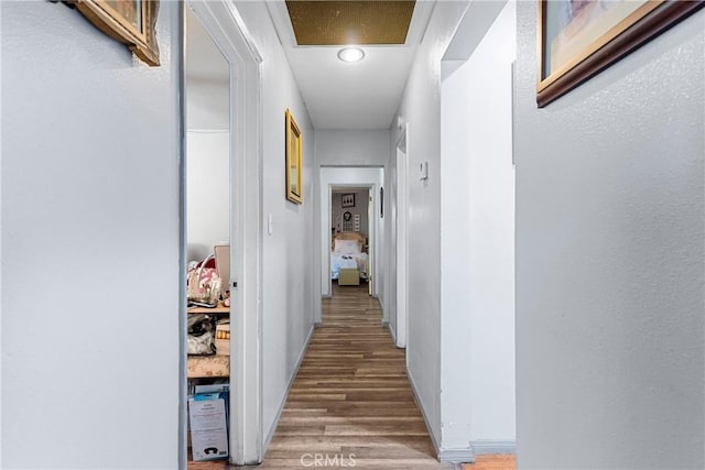 7738 Adwen St, Downey, CA 90241 - corridor with baseboards and wood finished floors