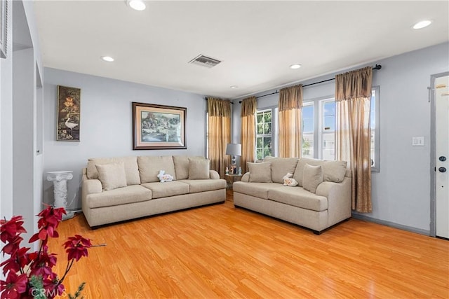 7738 Adwen St, Downey, CA 90241 - living room featuring recessed lighting, wood finished floors, and visible vents