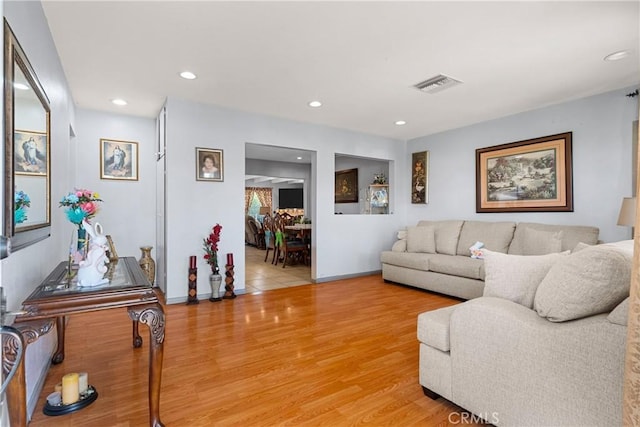 7738 Adwen St, Downey, CA 90241 - living room featuring visible vents, recessed lighting, baseboards, and light wood finished floors