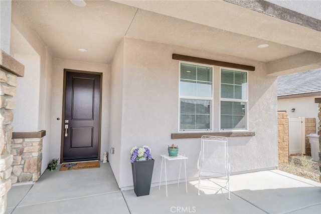 14168 Georgetown St, Hesperia, CA 92344 - view of exterior entry with stucco siding and a patio