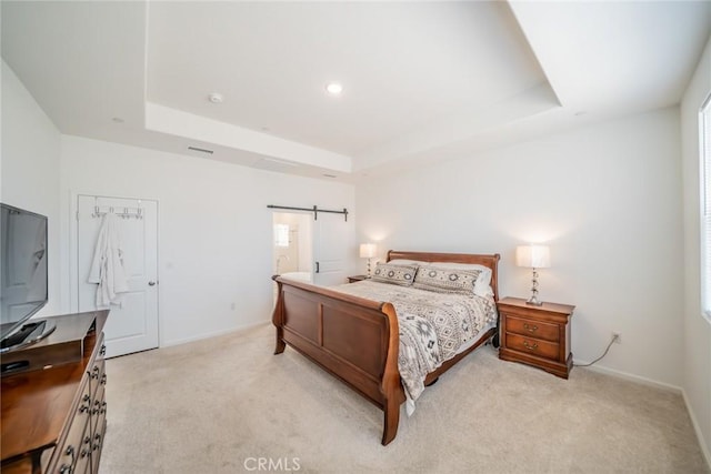 14168 Georgetown St, Hesperia, CA 92344 - bedroom featuring a tray ceiling, light carpet, baseboards, and a barn door