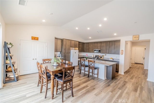14168 Georgetown St, Hesperia, CA 92344 - dining space with lofted ceiling, light wood-type flooring, and recessed lighting