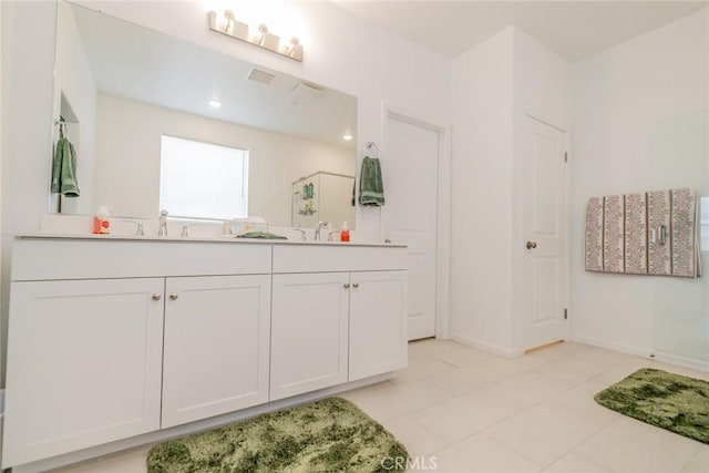 14168 Georgetown St, Hesperia, CA 92344 - full bathroom with double vanity, a shower, tile patterned floors, and baseboards