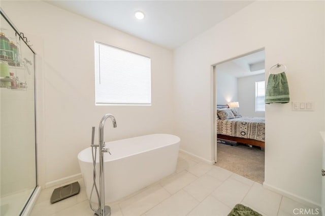14168 Georgetown St, Hesperia, CA 92344 - full bathroom with a freestanding tub, a shower stall, baseboards, and ensuite bathroom