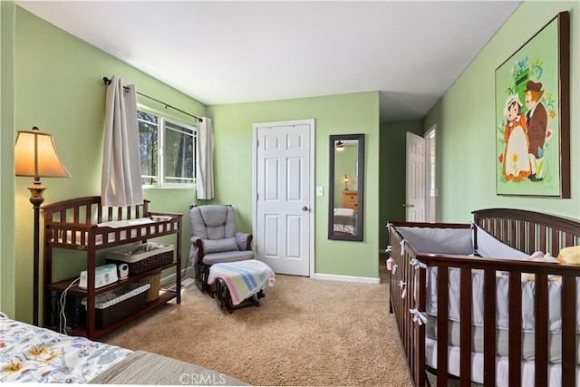 bedroom featuring baseboards and carpet floors