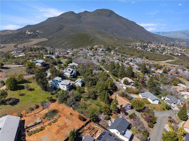 birds eye view of property with a mountain view and a residential view