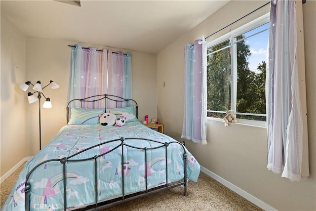 bedroom featuring baseboards and carpet flooring