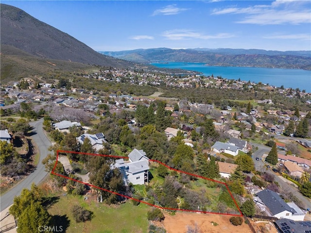bird's eye view featuring a water and mountain view