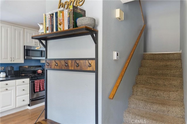 staircase with wood finished floors