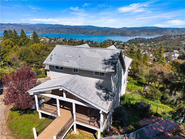 birds eye view of property featuring a water and mountain view
