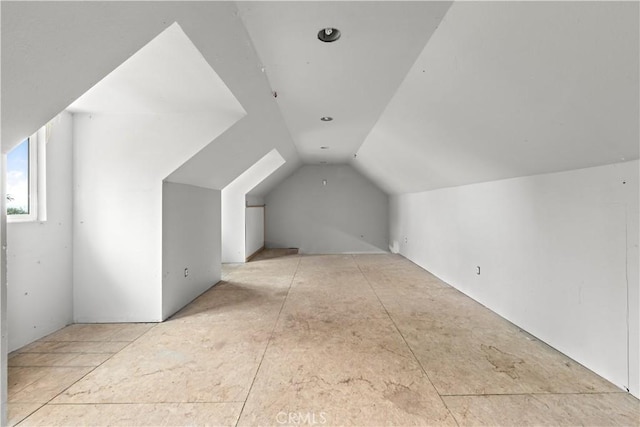 additional living space with lofted ceiling