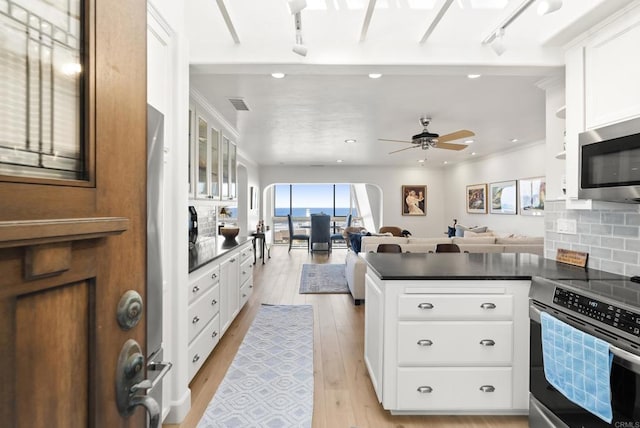 1552 Camino Del Mar Unit 623/625, Del Mar, CA 92014 - kitchen with appliances with stainless steel finishes, dark countertops, plenty of natural light, light wood finished floors, and recessed lighting