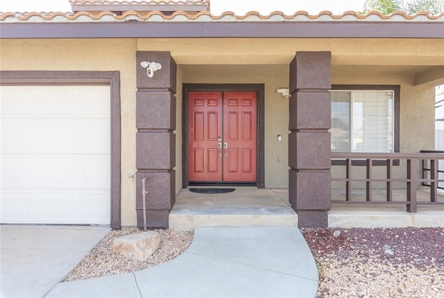 27077 Calendula St, Corona, CA 92883 - entrance to property with a porch, a garage, and stucco siding