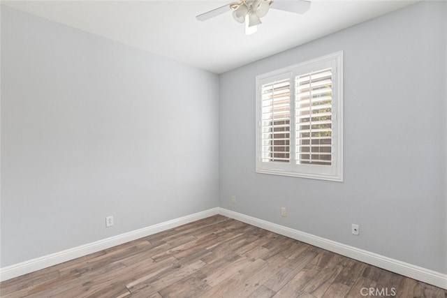 27077 Calendula St, Corona, CA 92883 - spare room with ceiling fan, wood finished floors, and baseboards