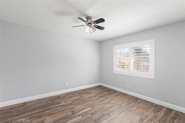 27077 Calendula St, Corona, CA 92883 - empty room featuring dark wood-style flooring, baseboards, and a ceiling fan