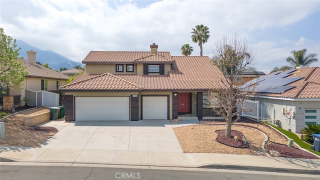 27077 Calendula St, Corona, CA 92883 - mediterranean / spanish-style home featuring stucco siding, a chimney, driveway, a garage, and a tiled roof