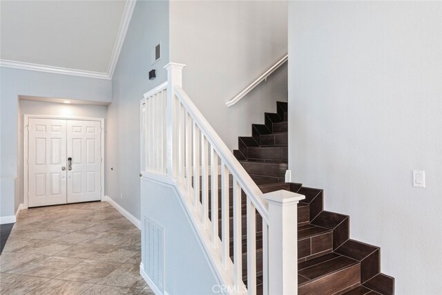 27077 Calendula St, Corona, CA 92883 - stairway with crown molding, visible vents, and baseboards