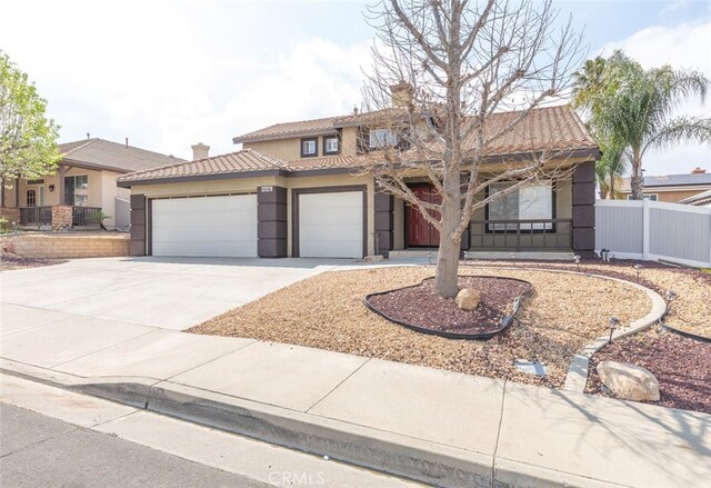 27077 Calendula St, Corona, CA 92883 - view of front of property with fence, stucco siding, an attached garage, and a chimney
