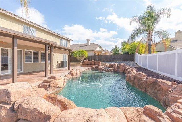 27077 Calendula St, Corona, CA 92883 - view of pool featuring cooling unit, a patio, a fenced backyard, and a fenced in pool