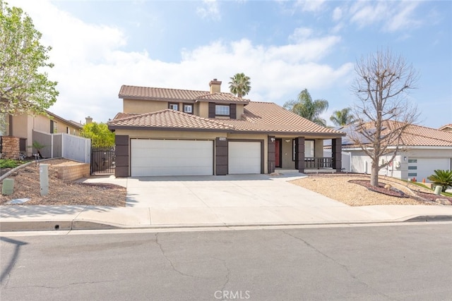 27077 Calendula St, Corona, CA 92883 - view of front of home featuring a garage, a chimney, a tile roof, fence, and a gate