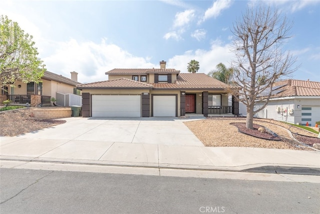 27077 Calendula St, Corona, CA 92883 - view of front facade featuring stucco siding, a tiled roof, a chimney, and an attached garage