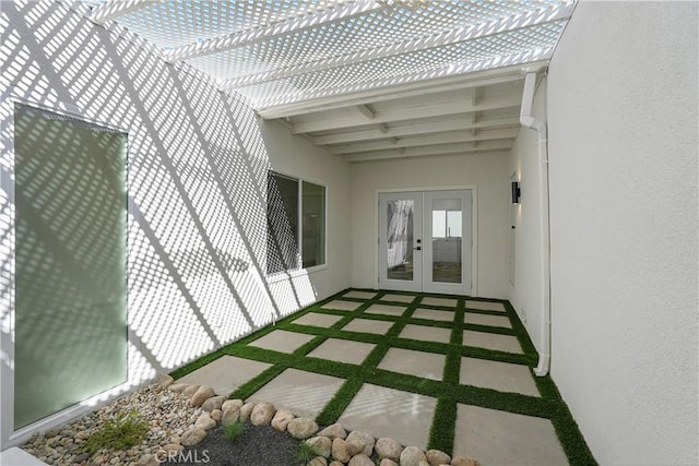 exterior space featuring a pergola and french doors
