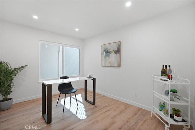 office area featuring recessed lighting, light wood-type flooring, and baseboards
