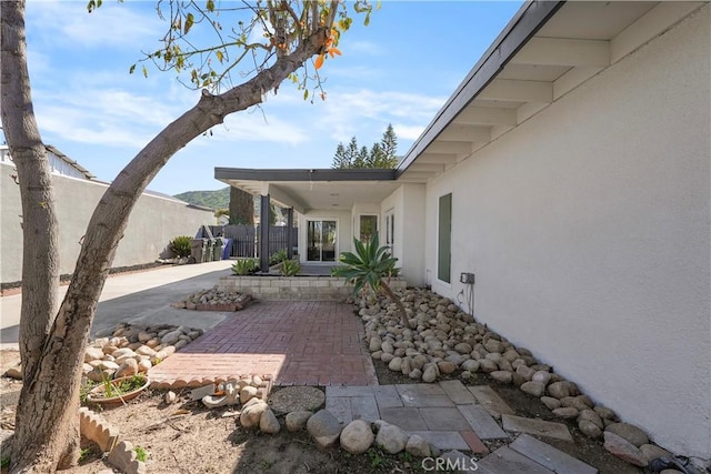 view of patio featuring fence