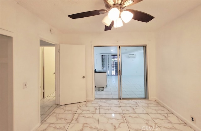 unfurnished bedroom with marble finish floor, baseboards, and a ceiling fan