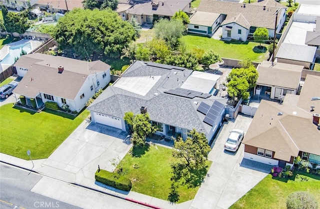 birds eye view of property with a residential view