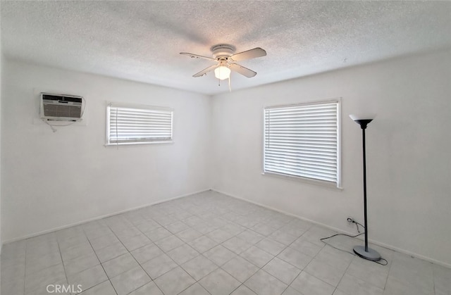 1020 E Rowland Ave, West Covina, CA 91790 - unfurnished room featuring a textured ceiling, an AC wall unit, and a ceiling fan