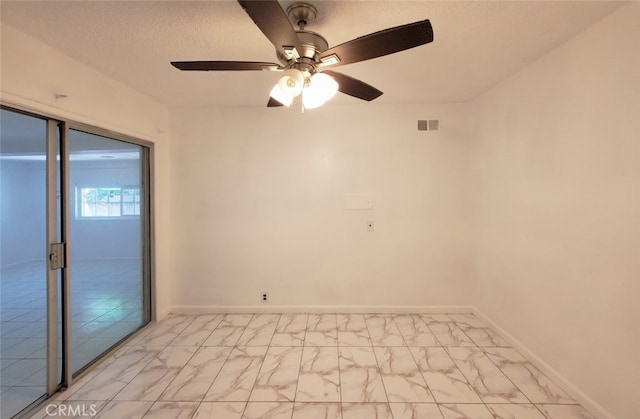 1020 E Rowland Ave, West Covina, CA 91790 - spare room with light marble finish floors, a ceiling fan, and a textured ceiling
