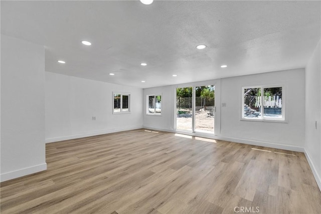 26339 First St, Loma Linda, CA 92318 - spare room featuring recessed lighting, light wood-style flooring, baseboards, and a textured ceiling