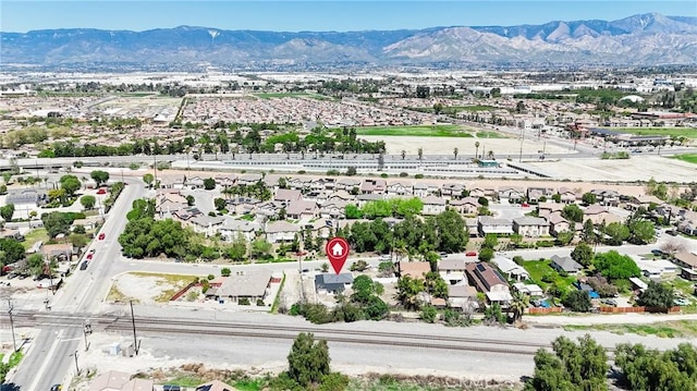 birds eye view of property featuring a mountain view