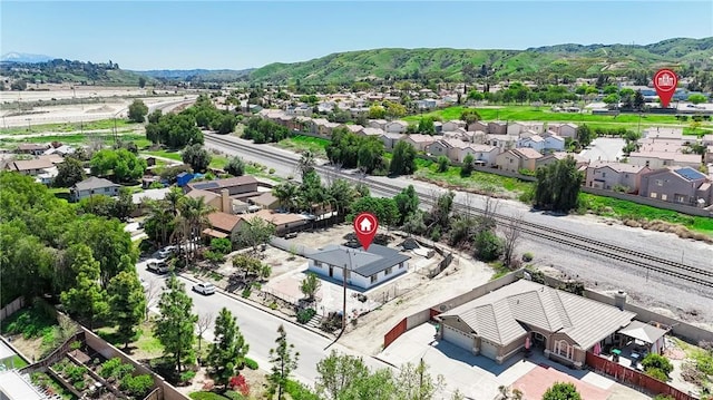 drone / aerial view featuring a mountain view and a residential view