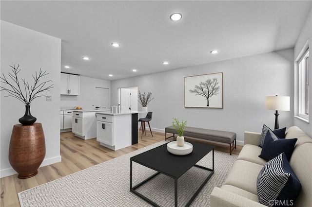 26339 First St, Loma Linda, CA 92318 - living area featuring light wood-style flooring, recessed lighting, and baseboards